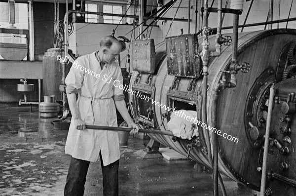 CREAMERY REMOVING FINISHED BUTTER FROM CHURN